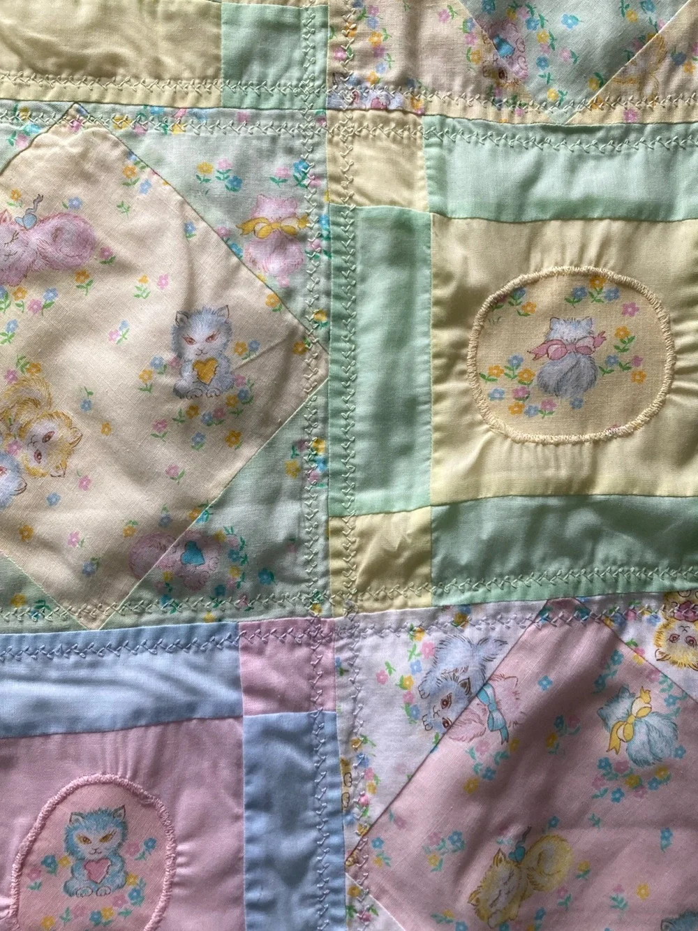 Handmade pastel kitten print baby quilt